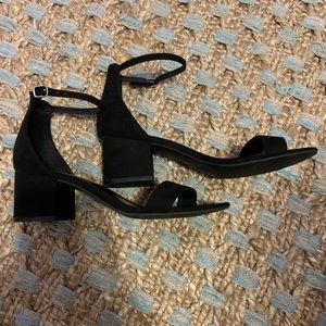 black suede 1 inch strap heels.